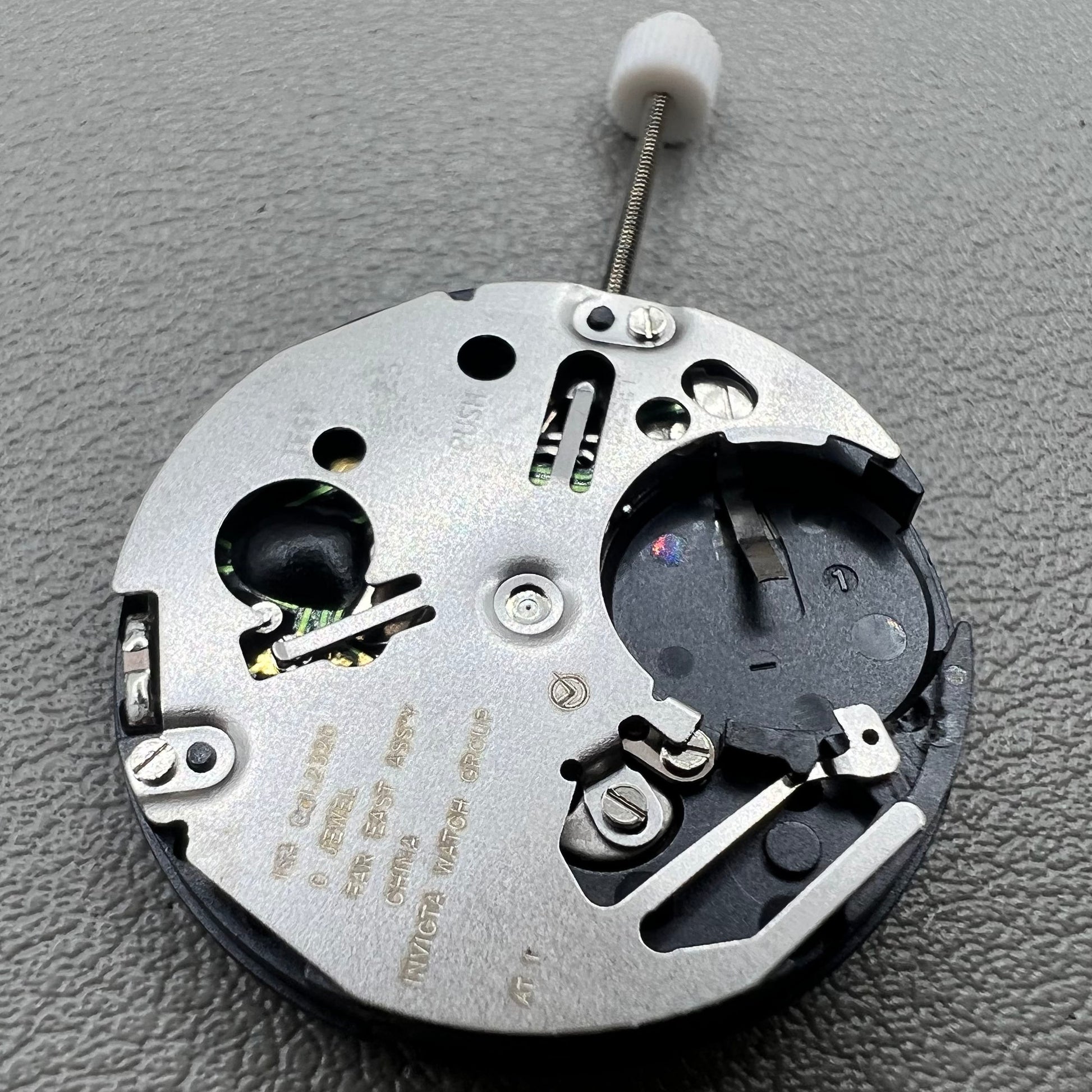 Swiss ISA 2320 watch accessory with white dial, quartz movement, date display at 3 o'clock by Swiss brand.