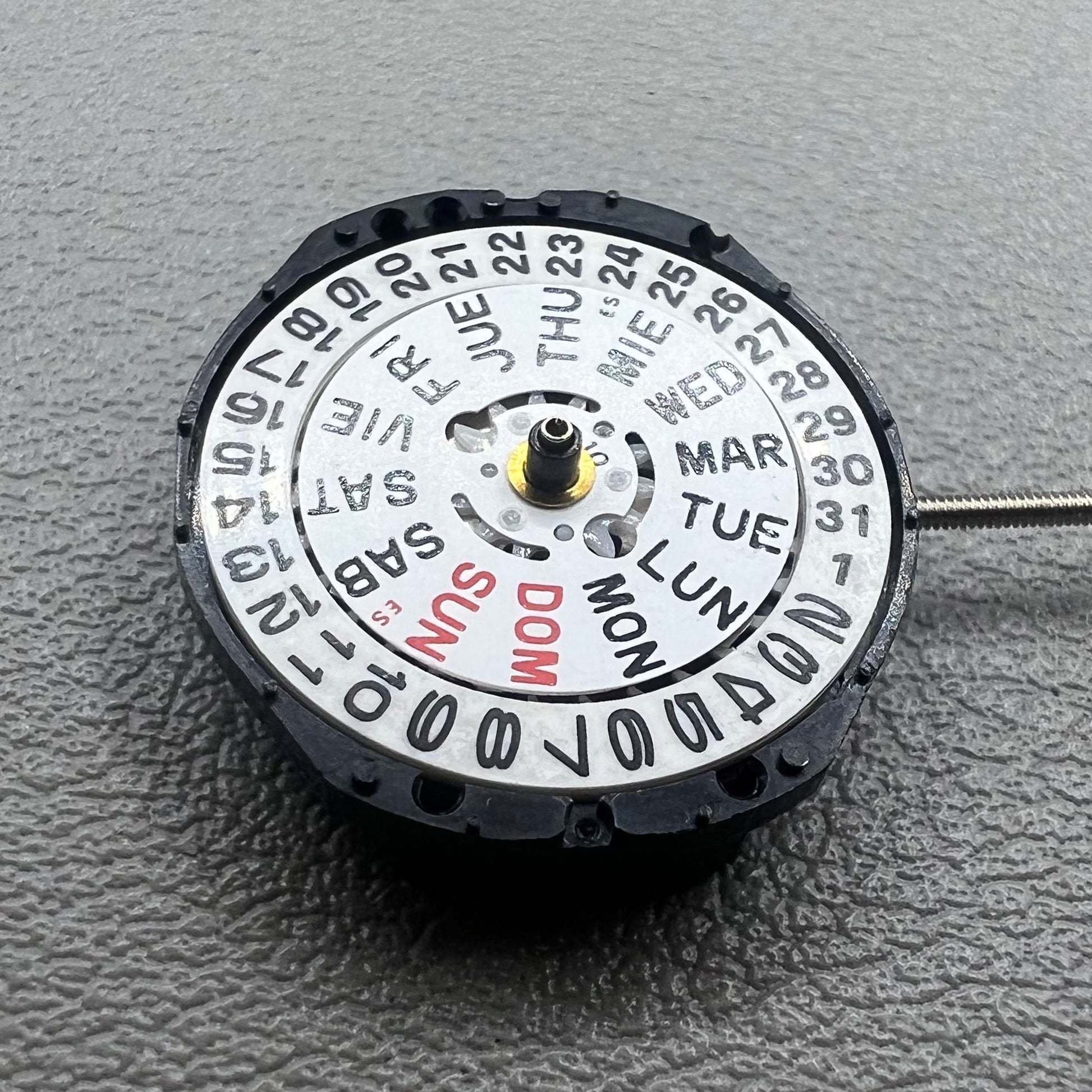 Japan PC23A Quartz watch movement showing 3 hands and double calendar functionality for precise timekeeping.