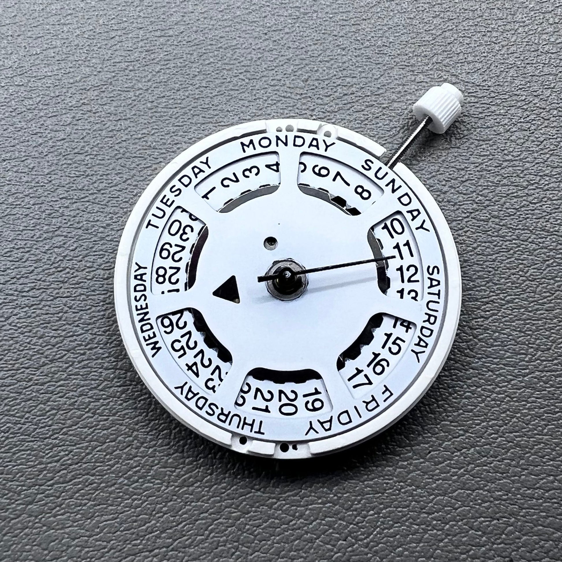 Swiss ISA 1198 watch movement with day-date feature, white dial, date at 3 o?clock.