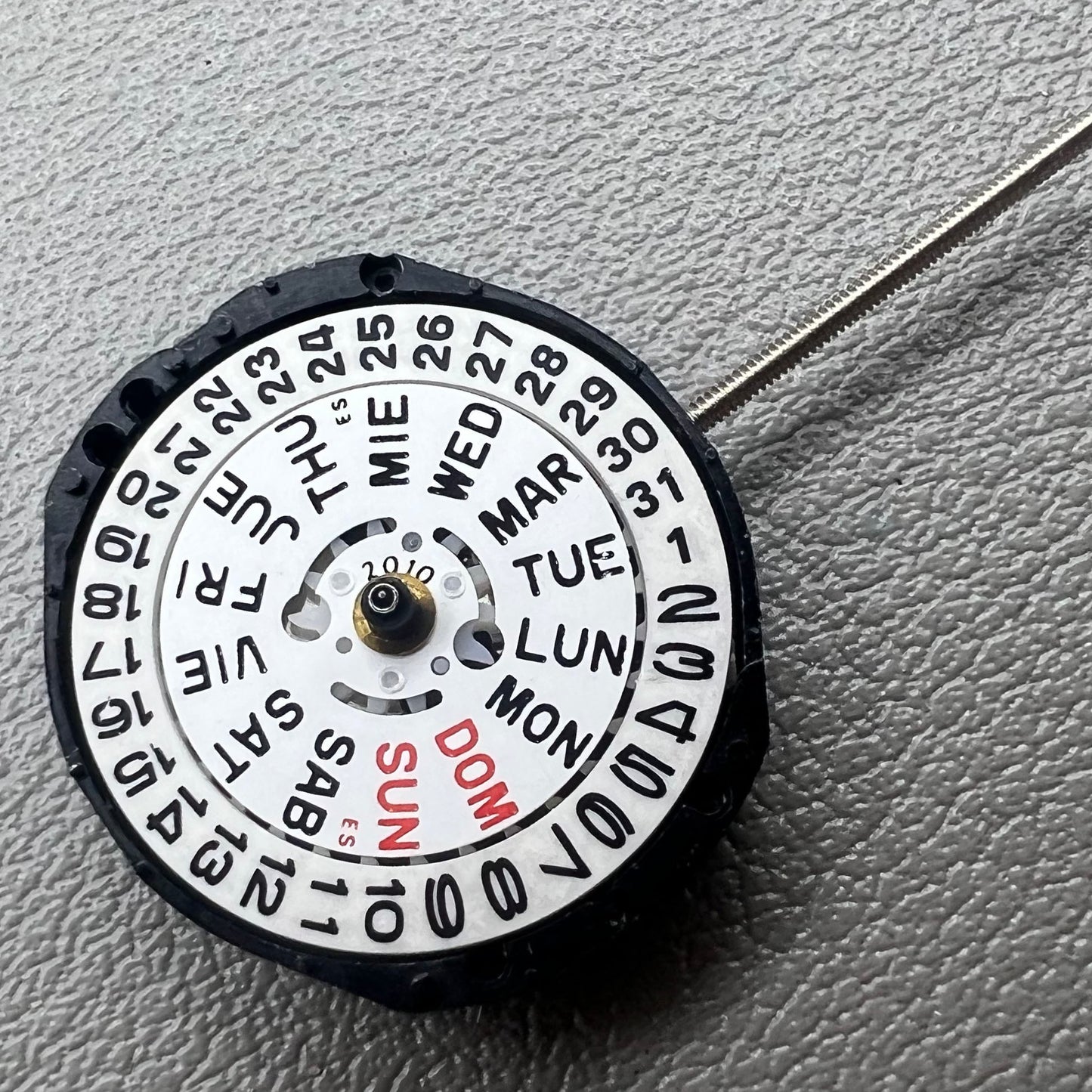 Japan PC23A Quartz watch movement showing 3 hands and double calendar functionality for precise timekeeping.