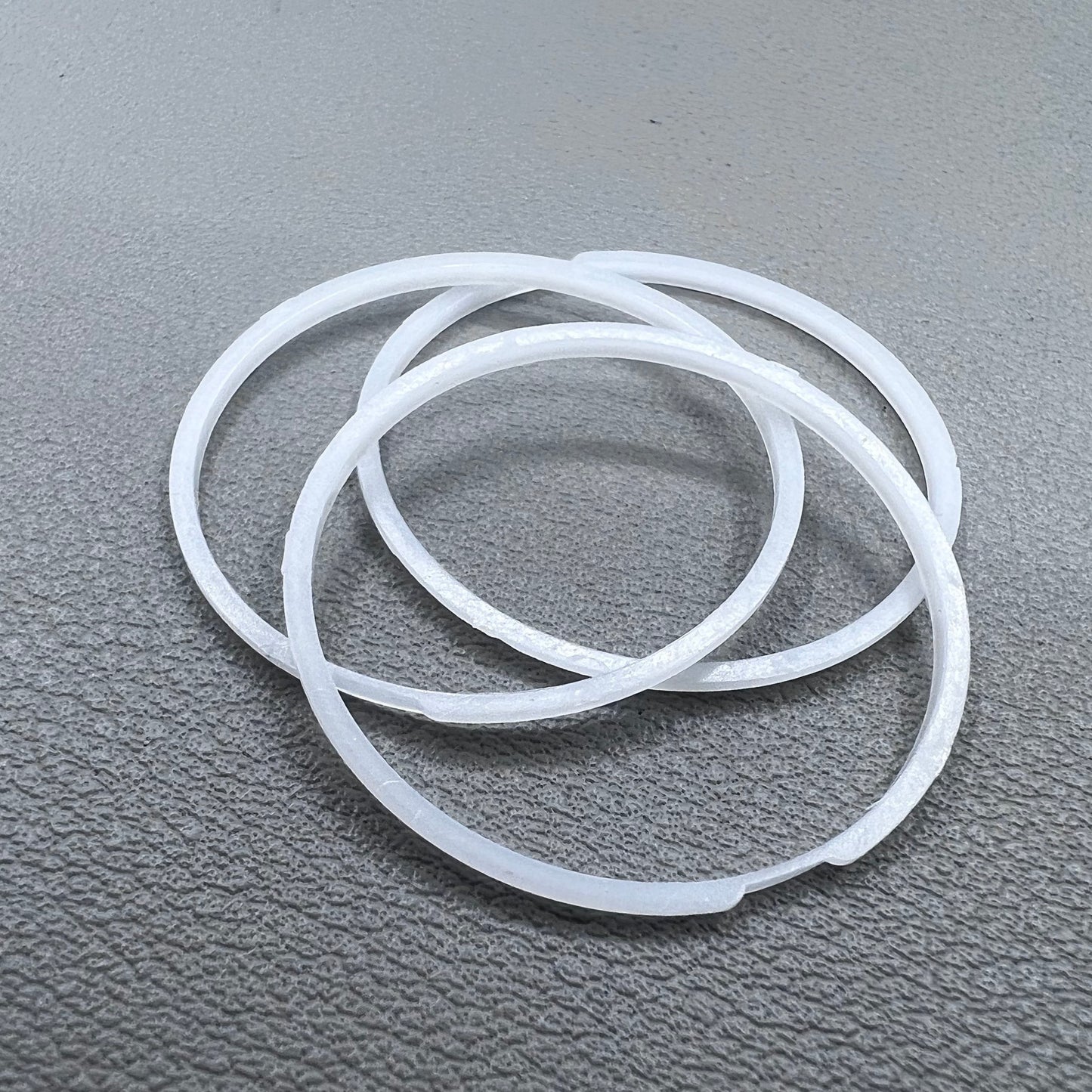White cushion mount spacer rings set of 3 for 7009 movement watches, precision fit.