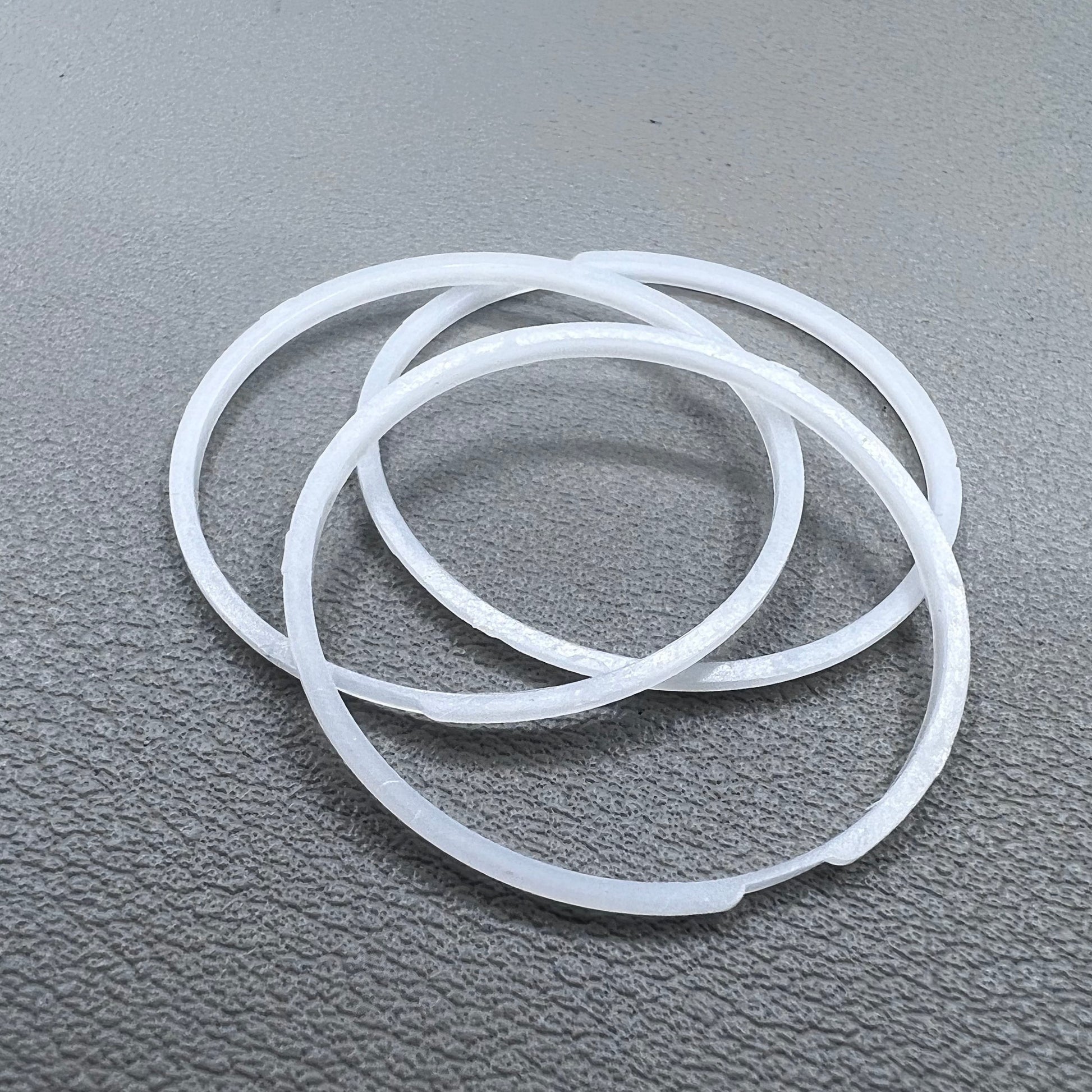 White cushion mount spacer rings set of 3 for 7009 movement watches, precision fit.