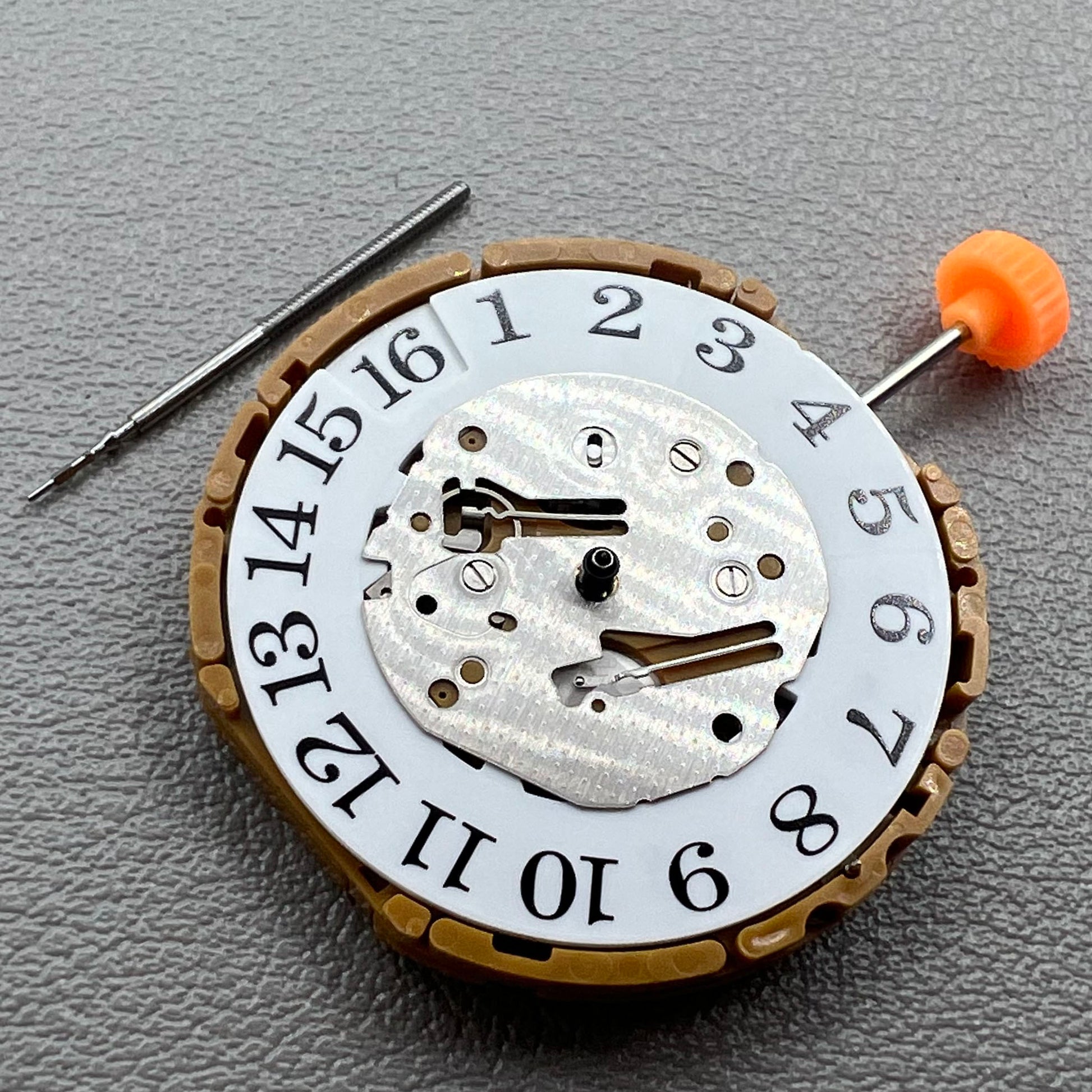 Japan Miyota GP00 quartz watch movement close-up, precision timekeeping mechanism for watches.