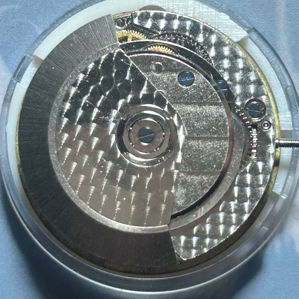 Dandong 7750 mechanical watch movement by China Made, featuring small second at 9 and date display at 3.