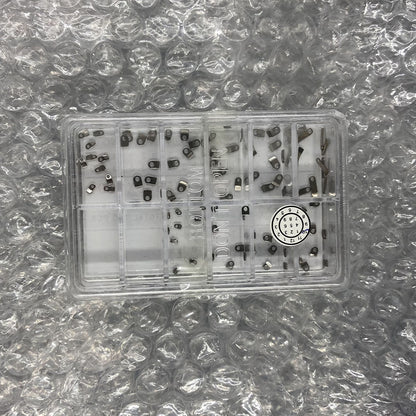 Casing clamps for watch movements, 10 sizes, 100pcs box, precision fit, durable watch repair tool.