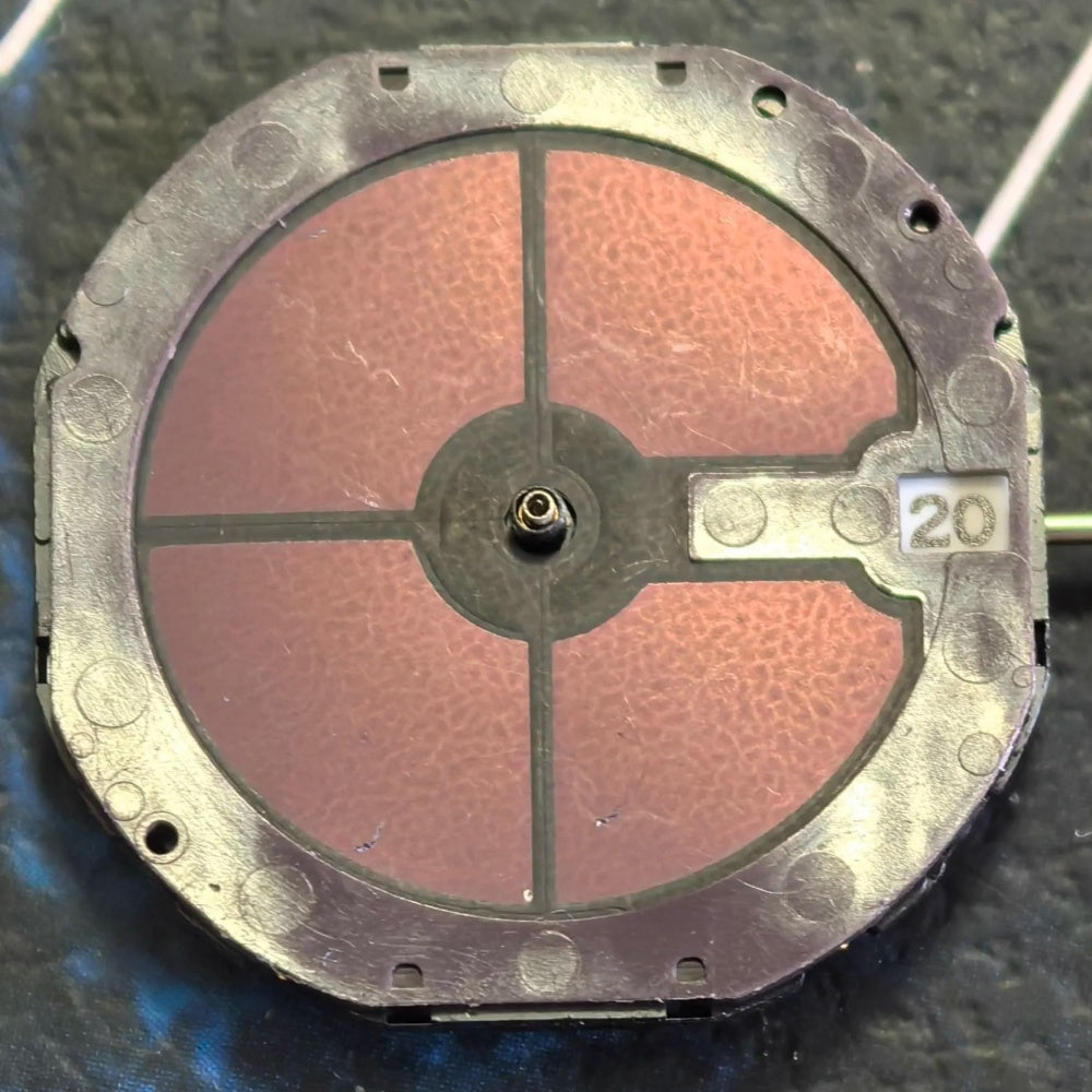 Citizen Eco-Drive E111M quartz watch movement with solar power and date display at 3 o'clock.