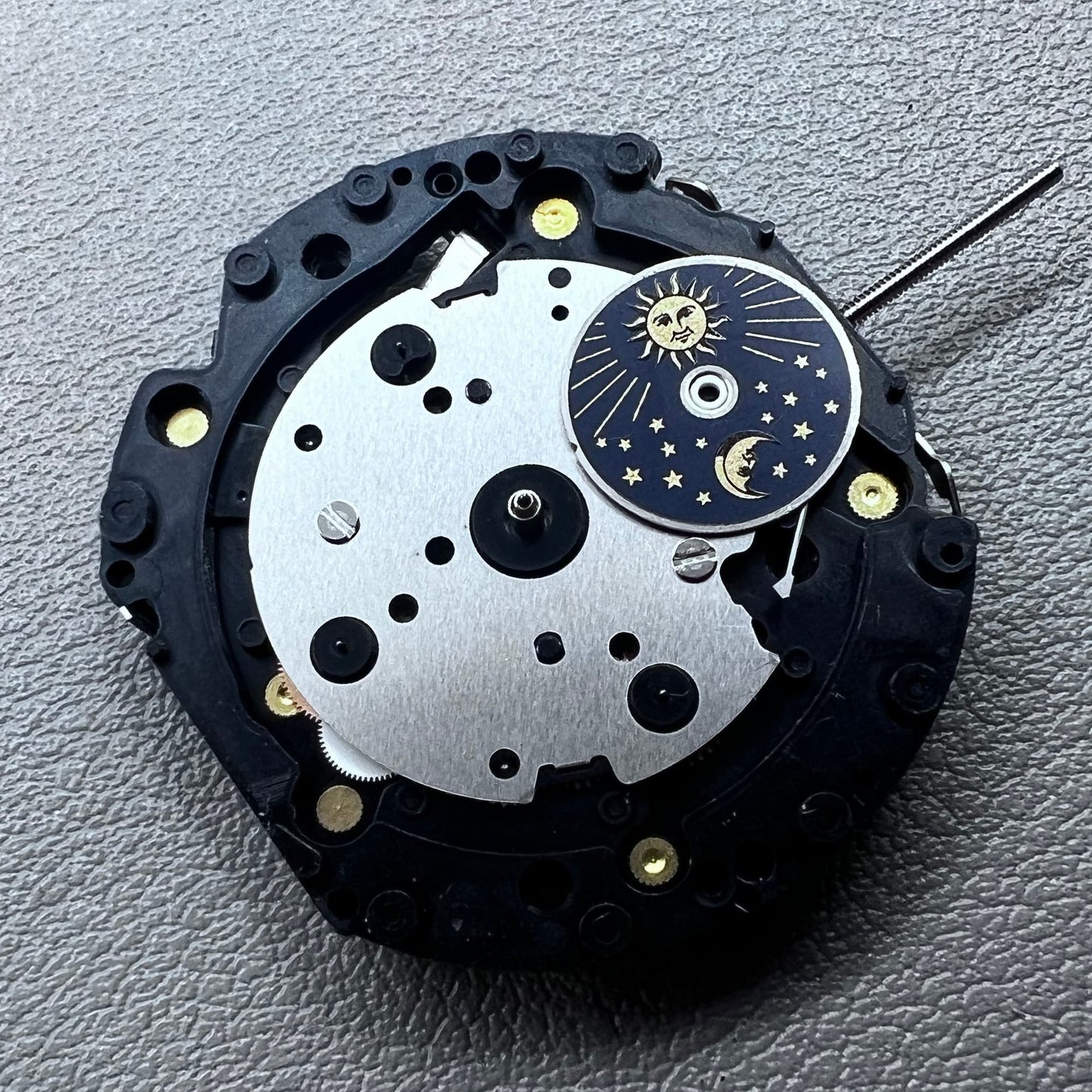 Original Japan VD59 watch movement close-up showing multifunctional quartz small second at 6/9/12 o'clock positions.