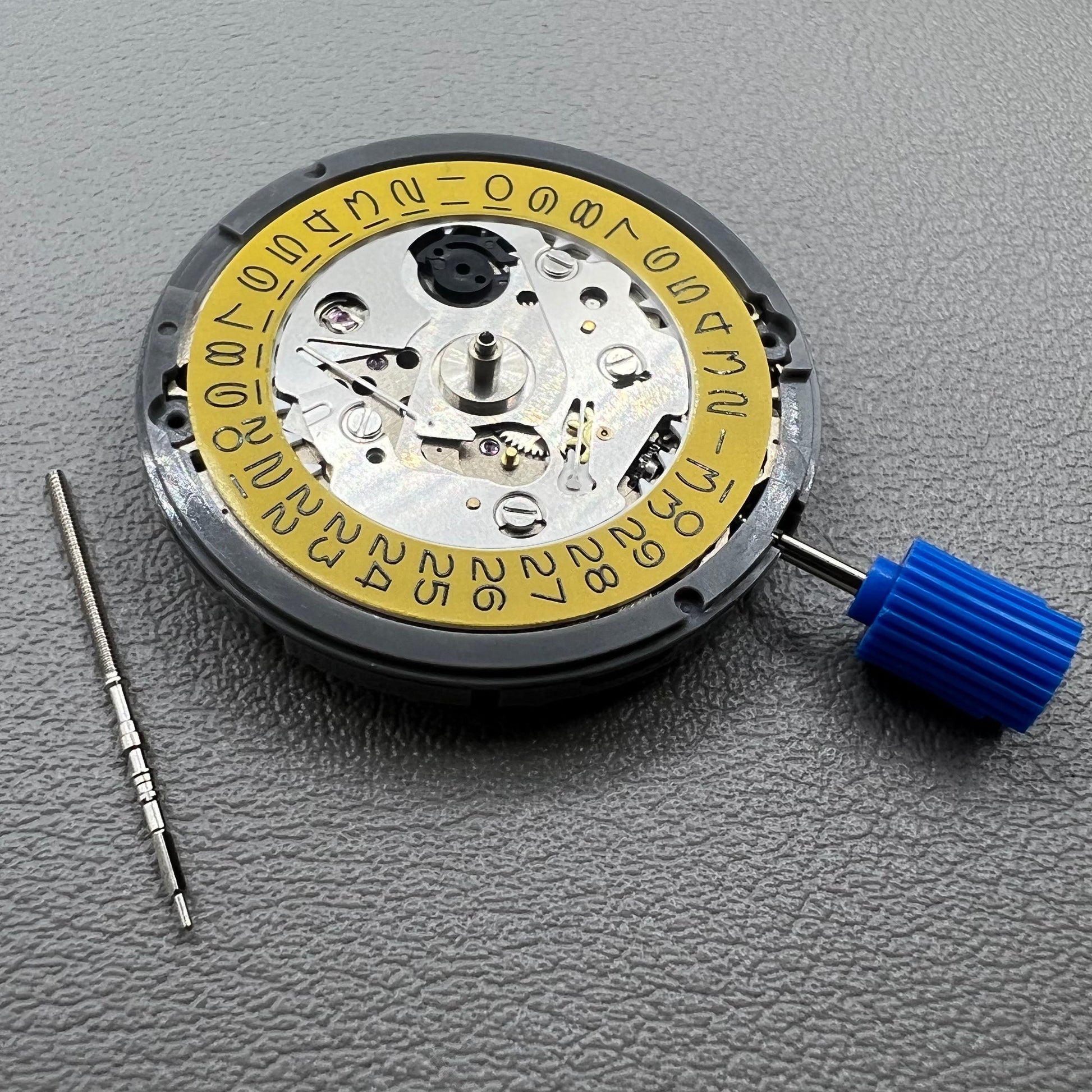 Seiko NH35 automatic watch movement with dark yellow dial, precision mechanical design by Japan.