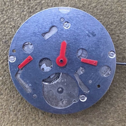 Miyota 2115 quartz movement by Japan Made with small second dial at 3, 6, and 9 o'clock positions.
