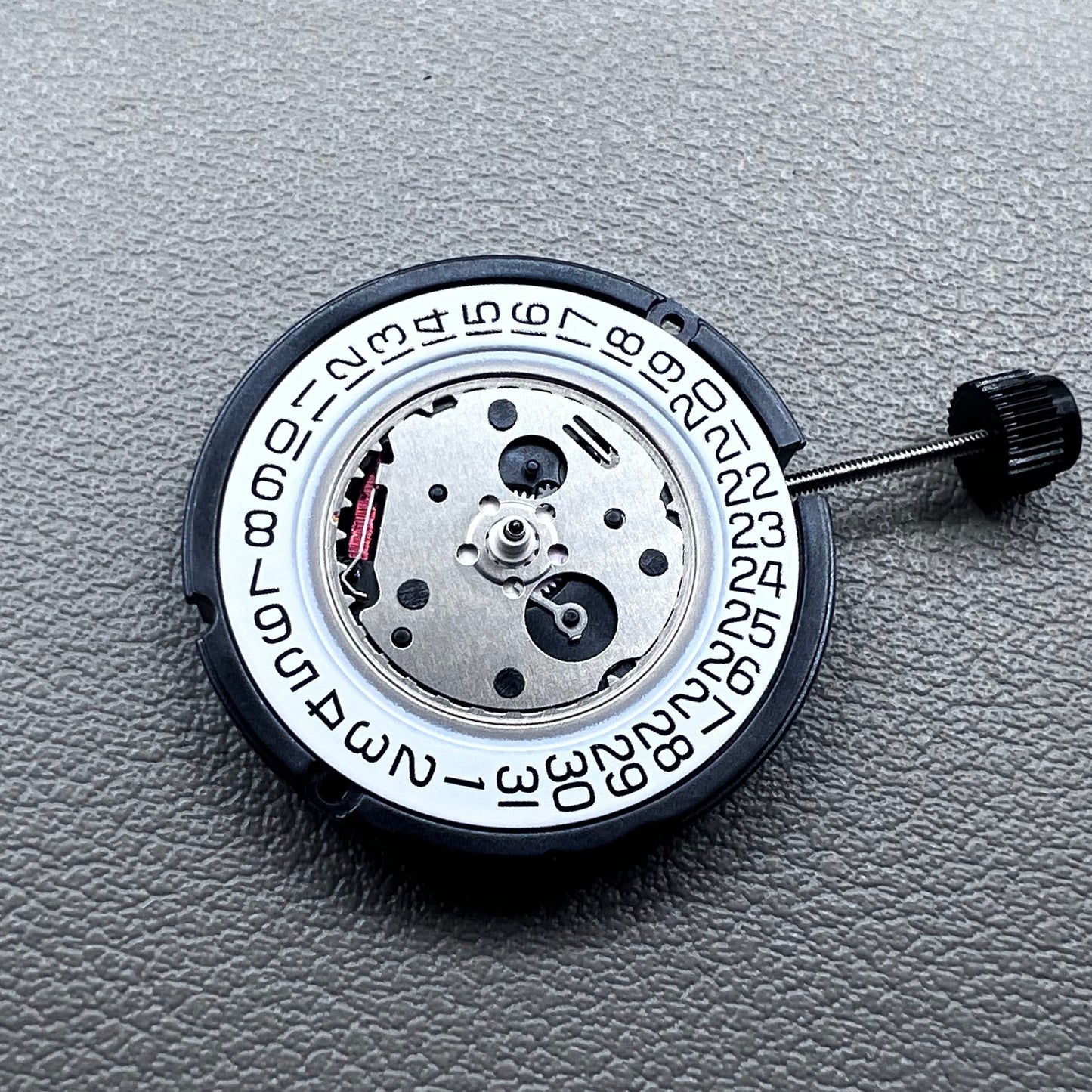 Swiss ETA 804.112 quartz watch movement showing precise 3 hands mechanism for accurate timekeeping.