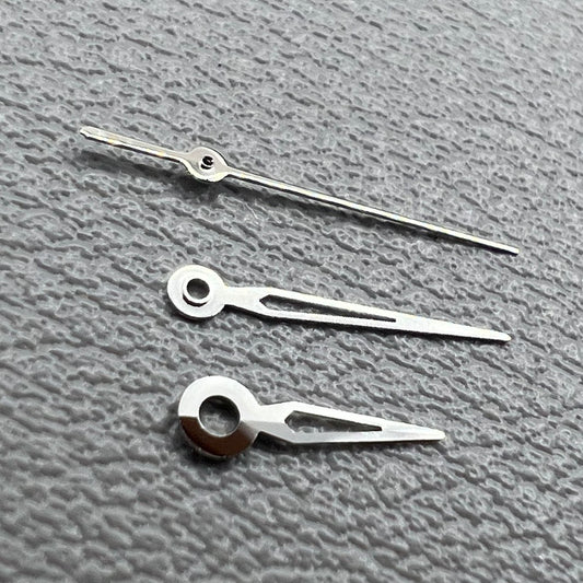 Hollow silver trim watch hands set for NH05 NH06 movement, compatible with watch repairs and customization.