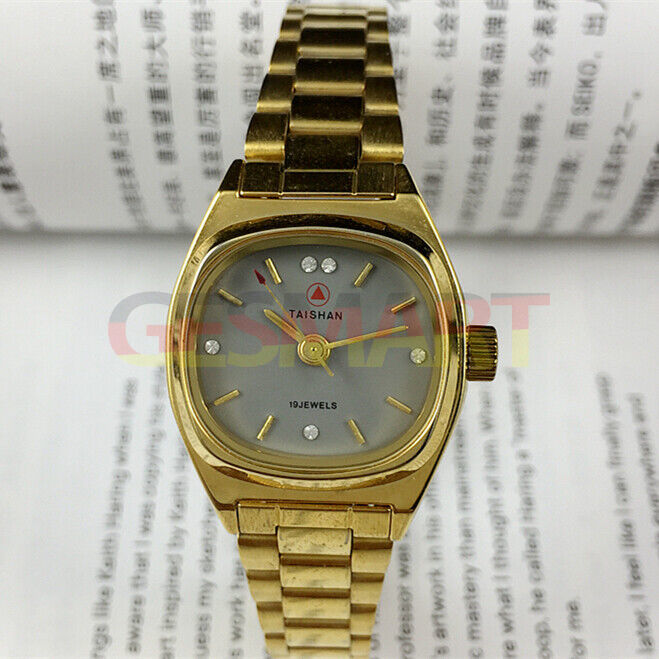 26mm Lady manual mechanical watch with grey dial, golden nail markers, and 19 jewels for elegant timekeeping.