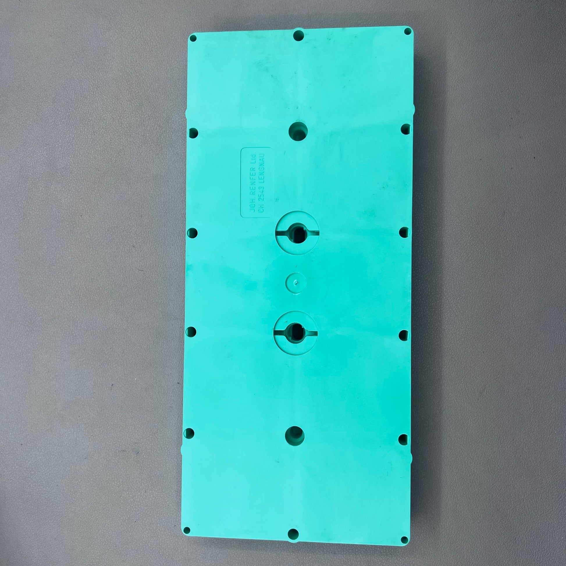 Swiss Horotec green plastic container with 10 compartments for organizing watch accessories.