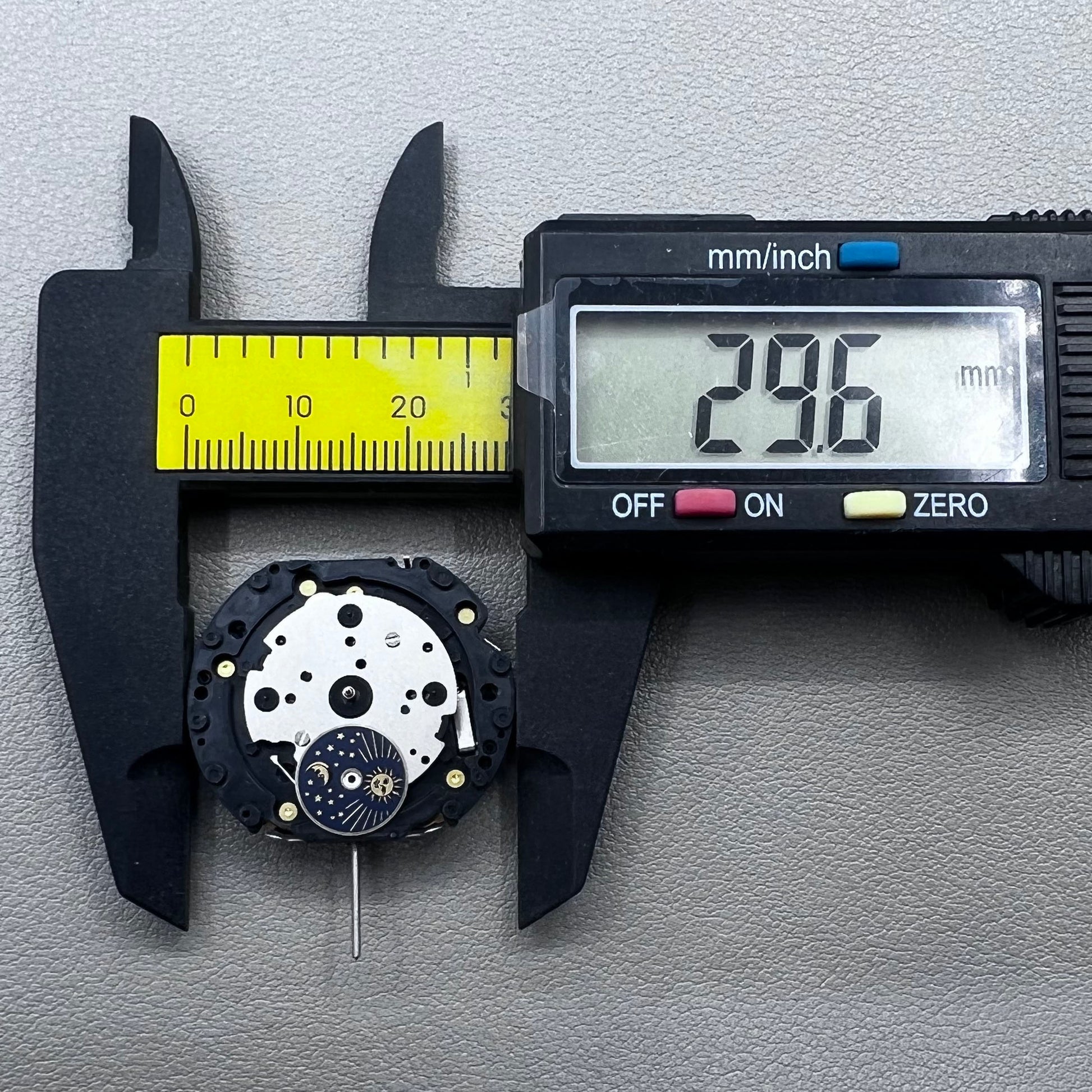 Original Japan VD59 watch movement close-up showing multifunctional quartz small second at 6/9/12 o'clock positions.