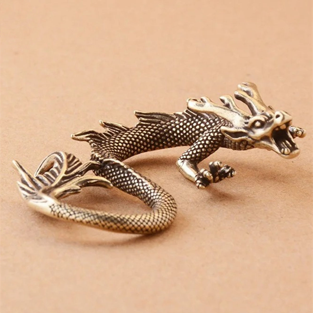 Hand-carved solid copper dragon trinket with vintage bronze finish, collectible.