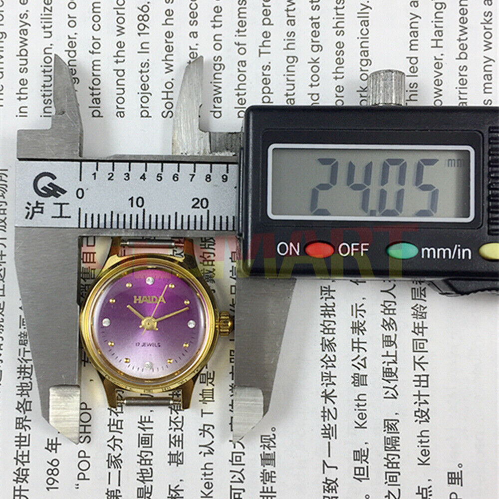 23mm SHANGHAI HAIDA lady watch with manual movement, imitation diamond markers, and elegant design.
