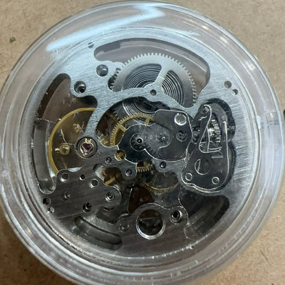 Silver hollow watch with 7120 automatic mechanical movement, 3 hands, large size - elegant timepiece.