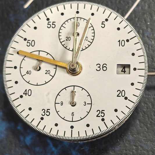 Chinese Dandong 7750 mechanical watch with single calendar and small seconds at 6, 9, and 12 o'clock positions.