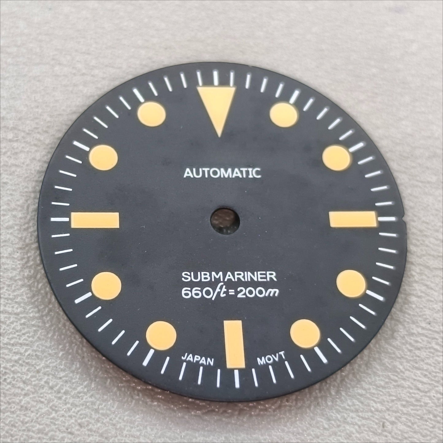 watch dial with S logo
