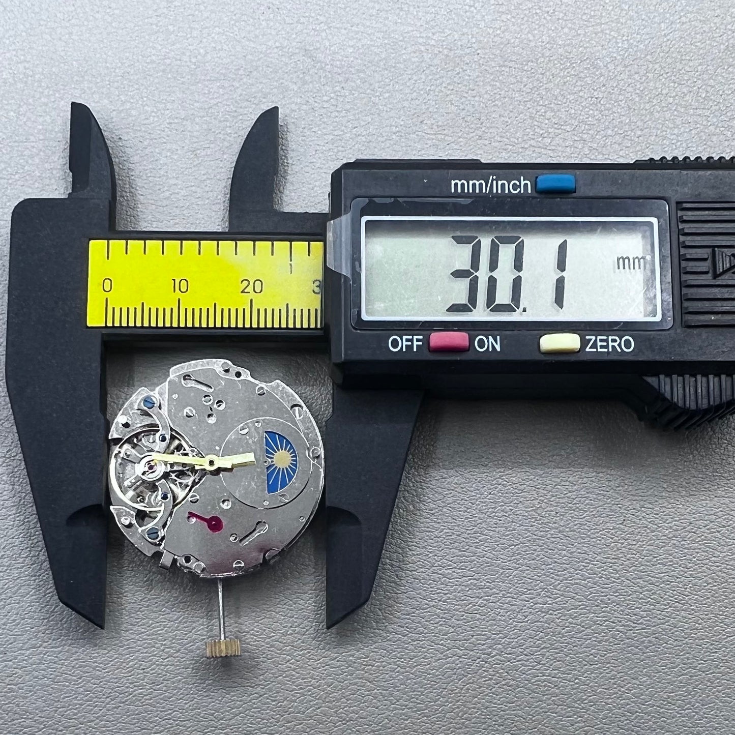 Silver Asian Dandong automatic watch with mechanical movement, date and week indicators, moon phase display.