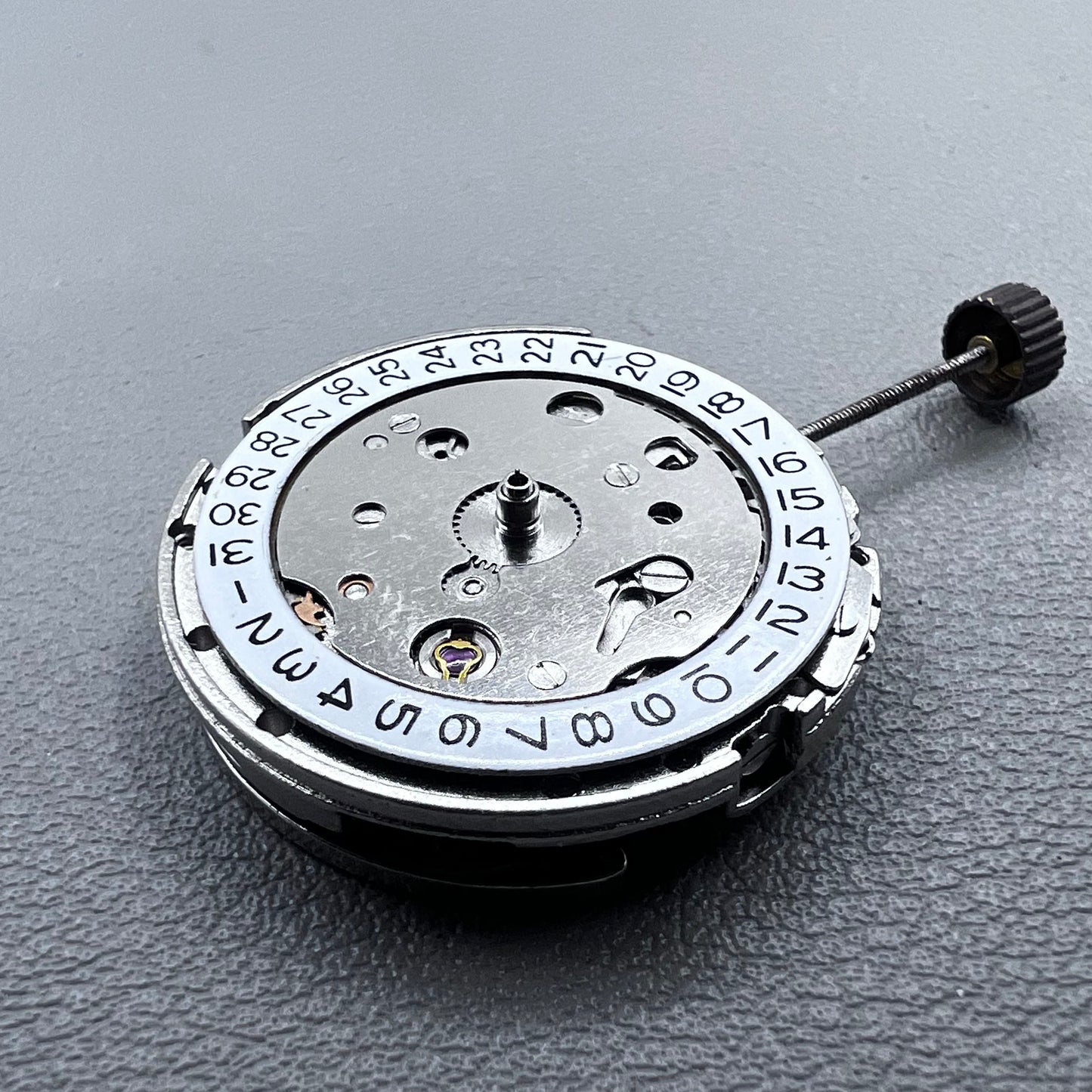 Dandong Silver automatic watch accessory showcasing precise mechanical movement with second stop feature.