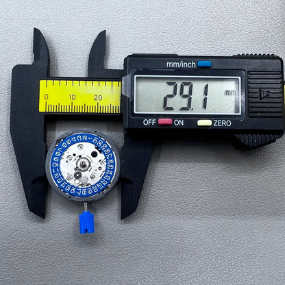 Seiko NH34 mechanical GMT watch movement with blue disk and white font for accurate timekeeping.