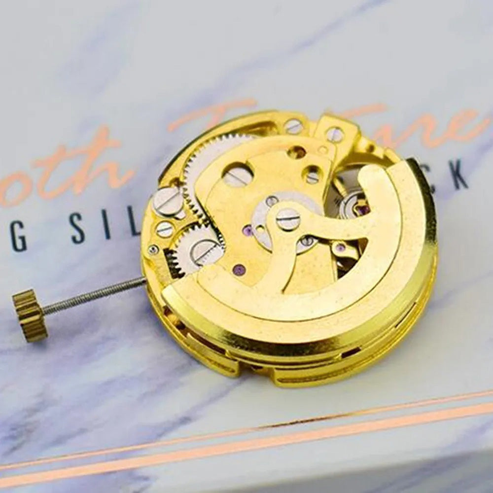 Gold 27mm 17-jewel skeleton automatic watch movement with pendulum adjustment by Radiation Pattern, 2004 model.