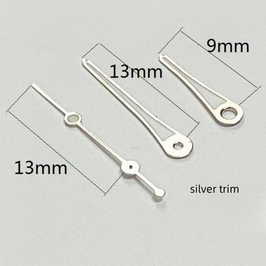 Silver trimmed green lume watch hands set for Ronda 515 quartz, enhancing visibility and style