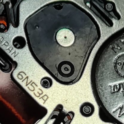 Seiko 6N53A quartz watch movement with day-date display and three hands for accurate watch repair.