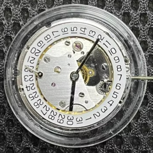 Asian 7750 automatic chronograph movement showing day-date at 3 o'clock, high precision ETA style mechanism