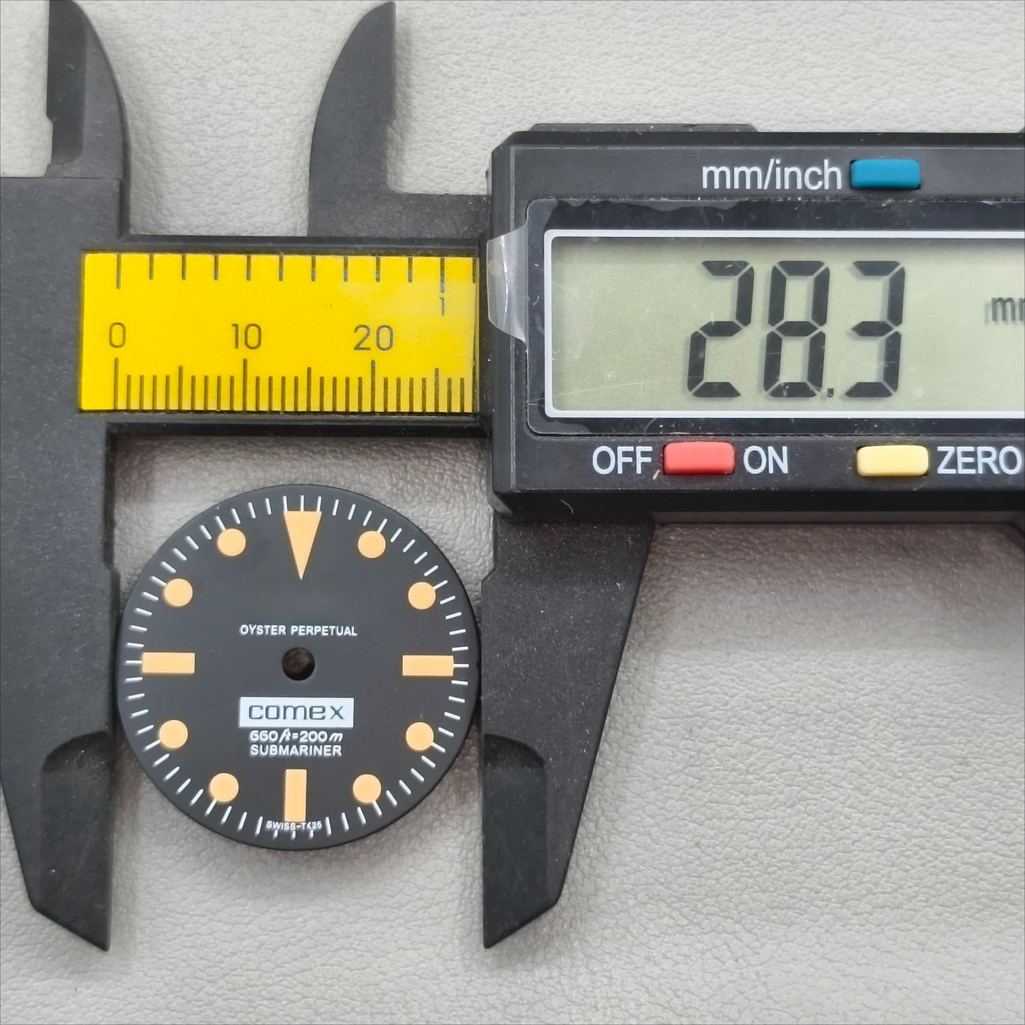 watch dial with R logo