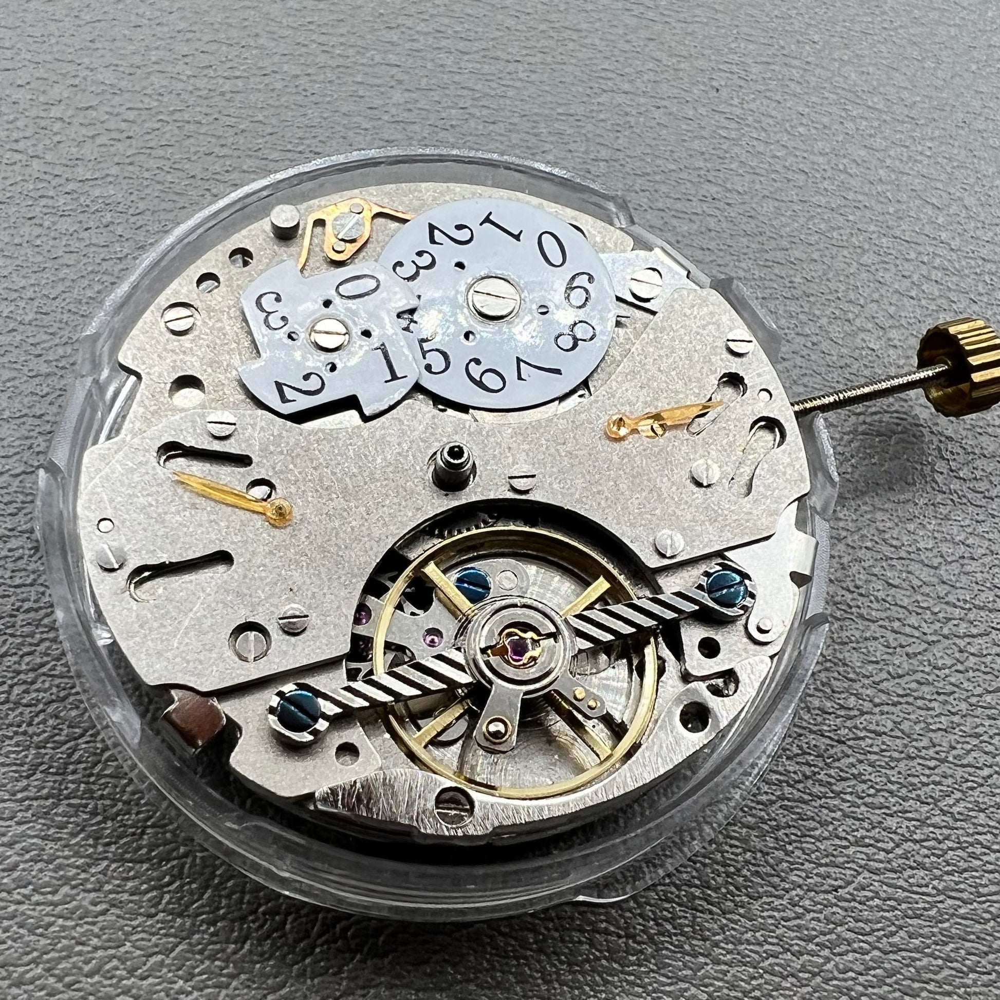 Wenzhou Mechanical watch movement with bare balance wheel and big date display at 12 o'clock.