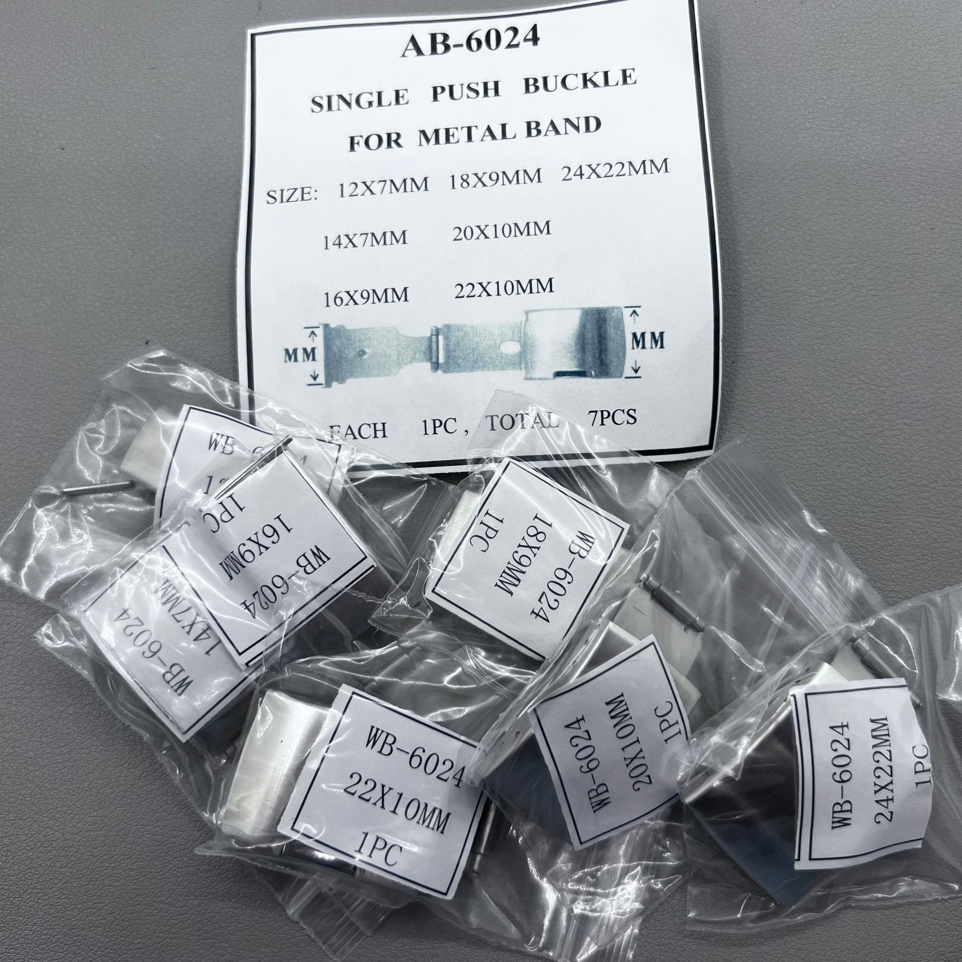 Seven sizes of Metan single push watch buckles for secure watch band fastening.