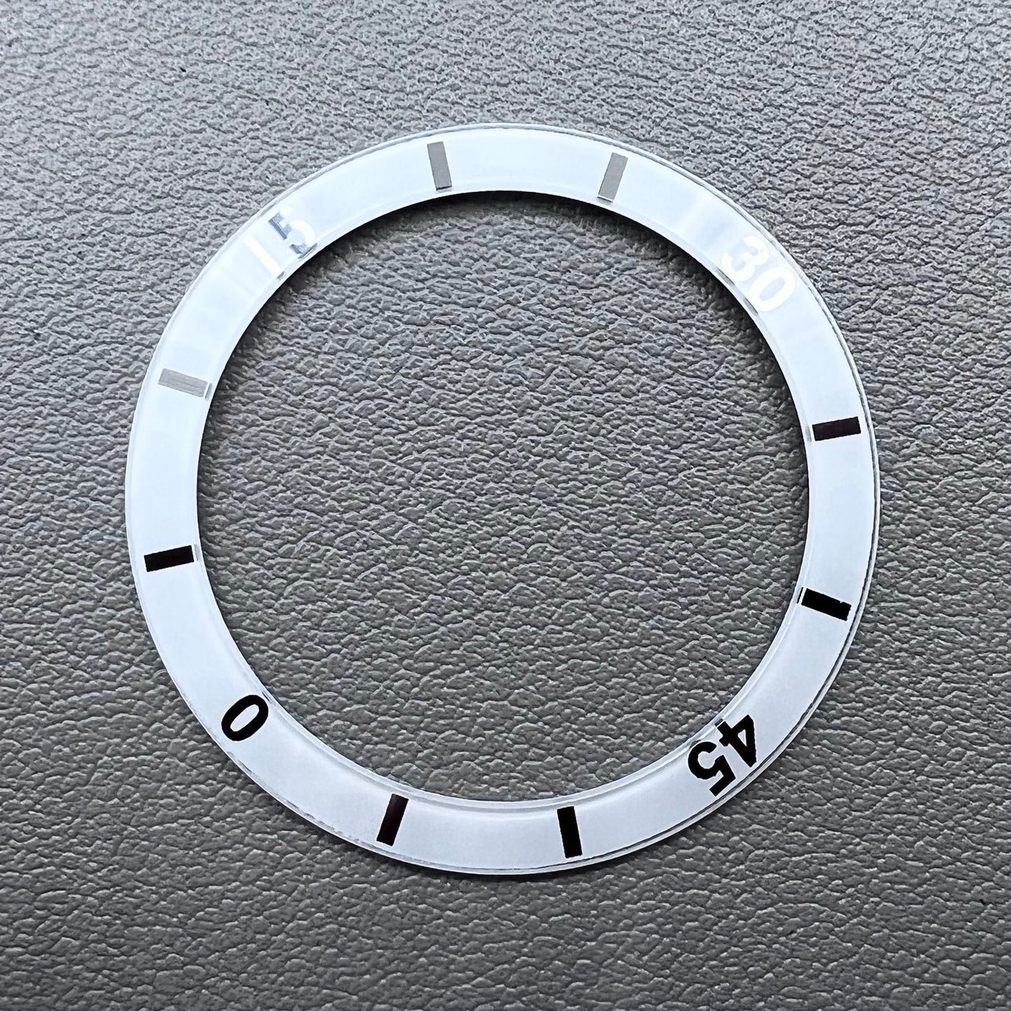 White 36mm ceramic watch bezel insert with numeral markings for men's and women's watches.