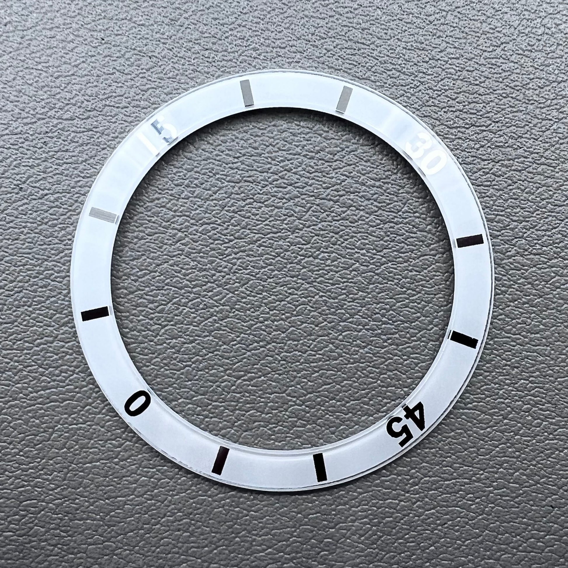 White 36mm ceramic watch bezel insert with numeral markings for men's and women's watches.