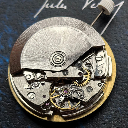 Chinese Dandong 7750 mechanical watch movement displaying big date at 12 and small seconds at 4/8 positions.