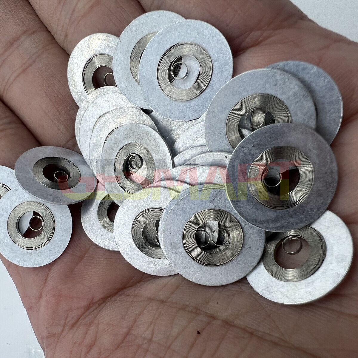 Silver mainspring for Movement 7009#180, compatible watch part enhancing timekeeping precision.