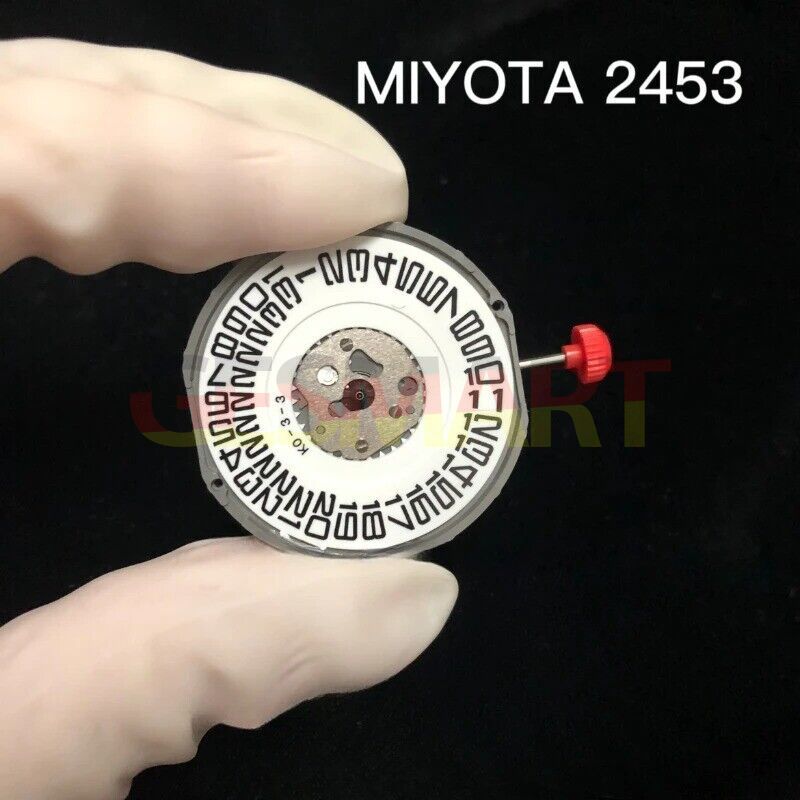 Quartz watch movement Miyota 2453 with date at 3 o'clock and attached stem for precision timekeeping.