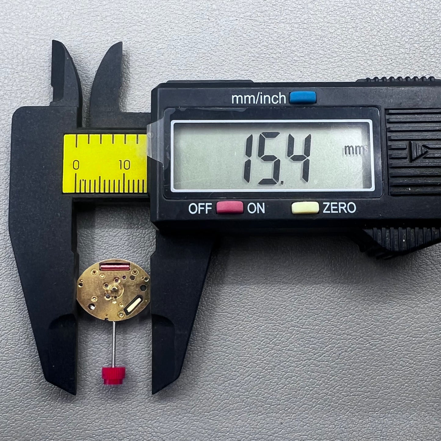 Close-up of Swiss ETA 980.103 quartz watch movement showcasing precision engineering and reliability.