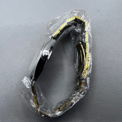 32mm golden stainless steel manual watch with 17 jewels and Roman numeral dial.