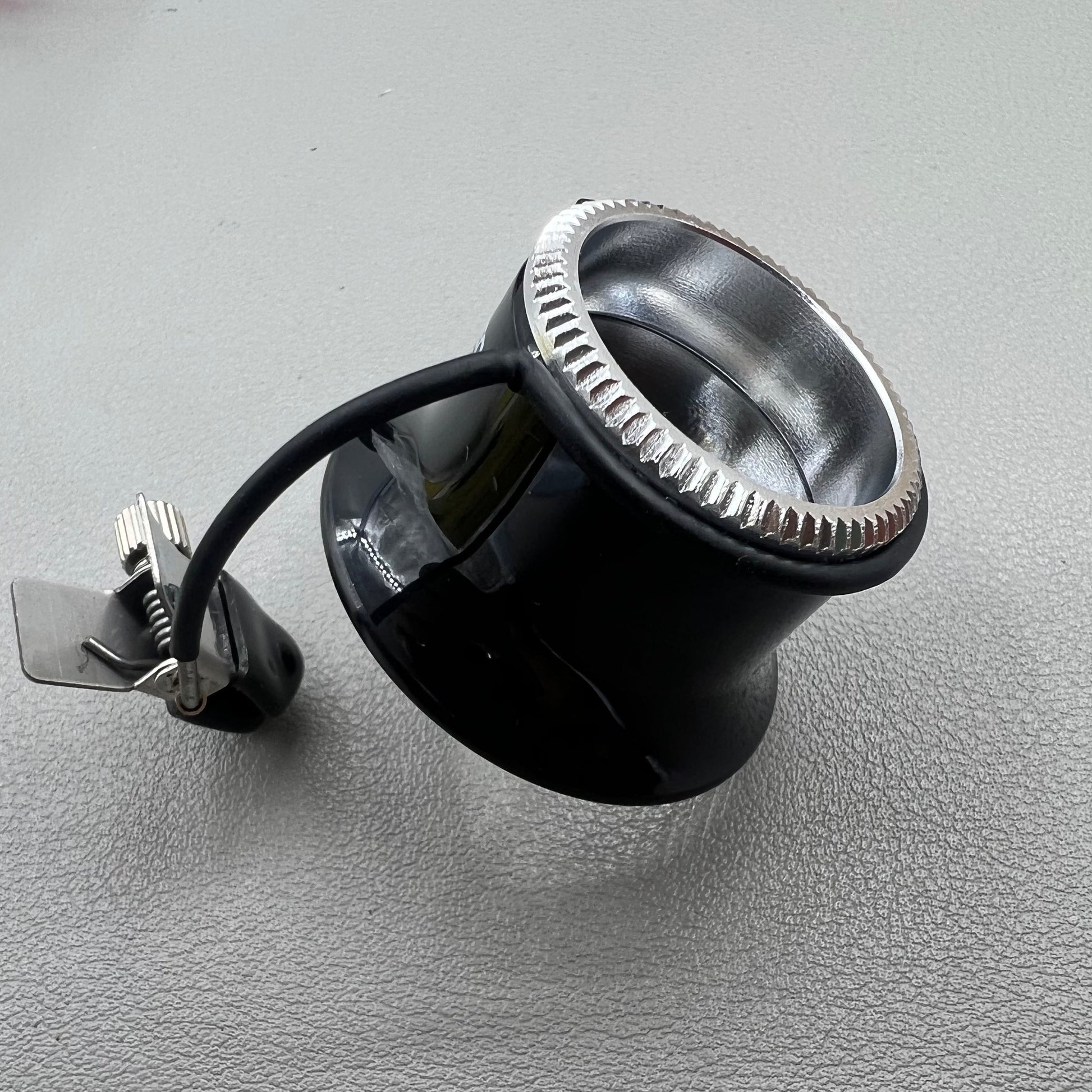 Swiss Bergeon 7913 eyeglass with clip-on magnifier, ideal for detailed watch repairs and accessories.