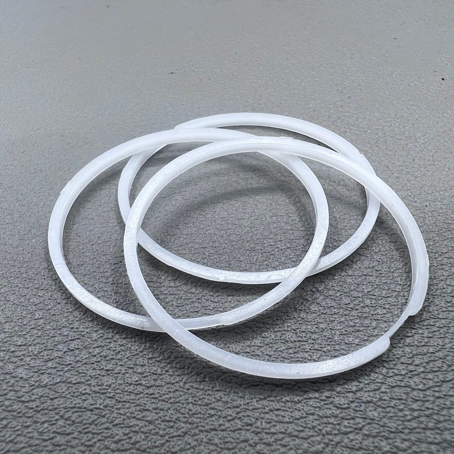 White cushion mount spacer rings set of 3 for 7009 movement watches, precision fit.