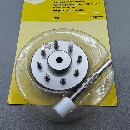 Swiss Bergeon 5378 watch hand fitting tool with 9 stakes on holder for precise hand installation.