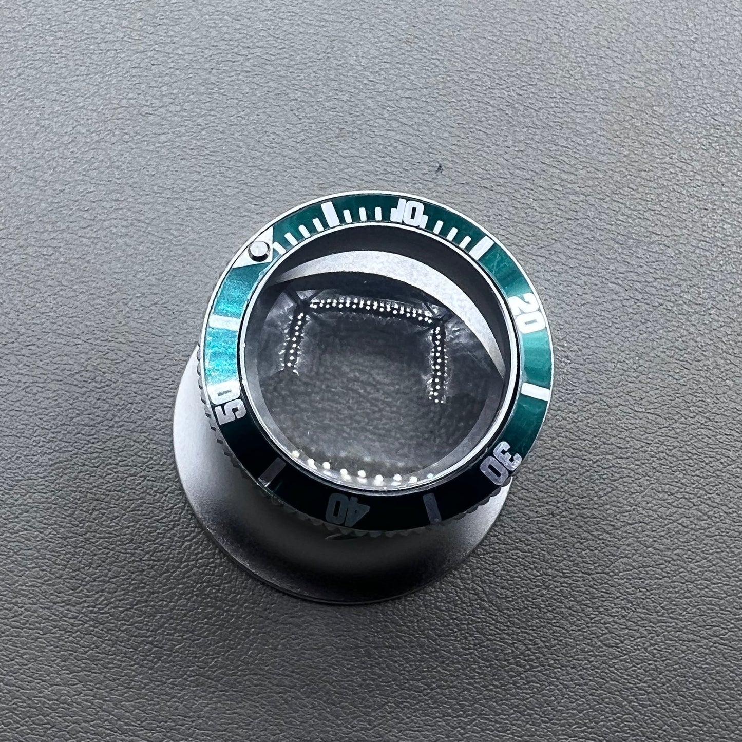 Jewelers 20X Green Loupe Magnifier with premium aluminum frame for detailed watch accessory inspection.