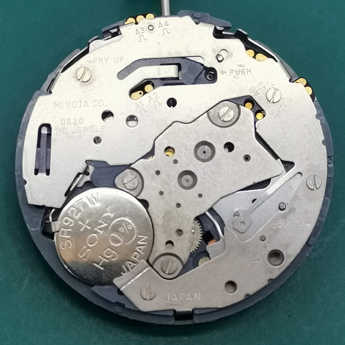 Japan Miyota OS20 quartz watch movement with date display at 4:30, precision-crafted for watchmakers.