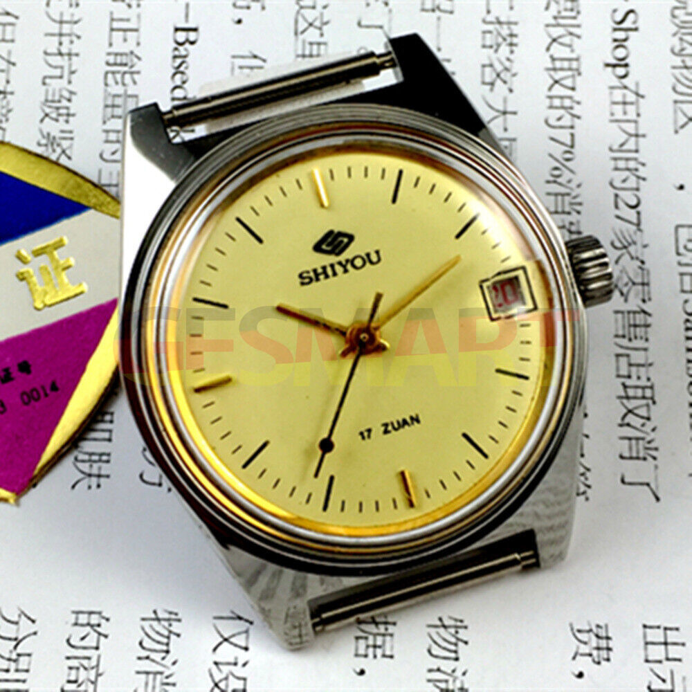 33mm Chinese manual mechanical watch with golden dial and calendar, featuring a round case for elegant style.