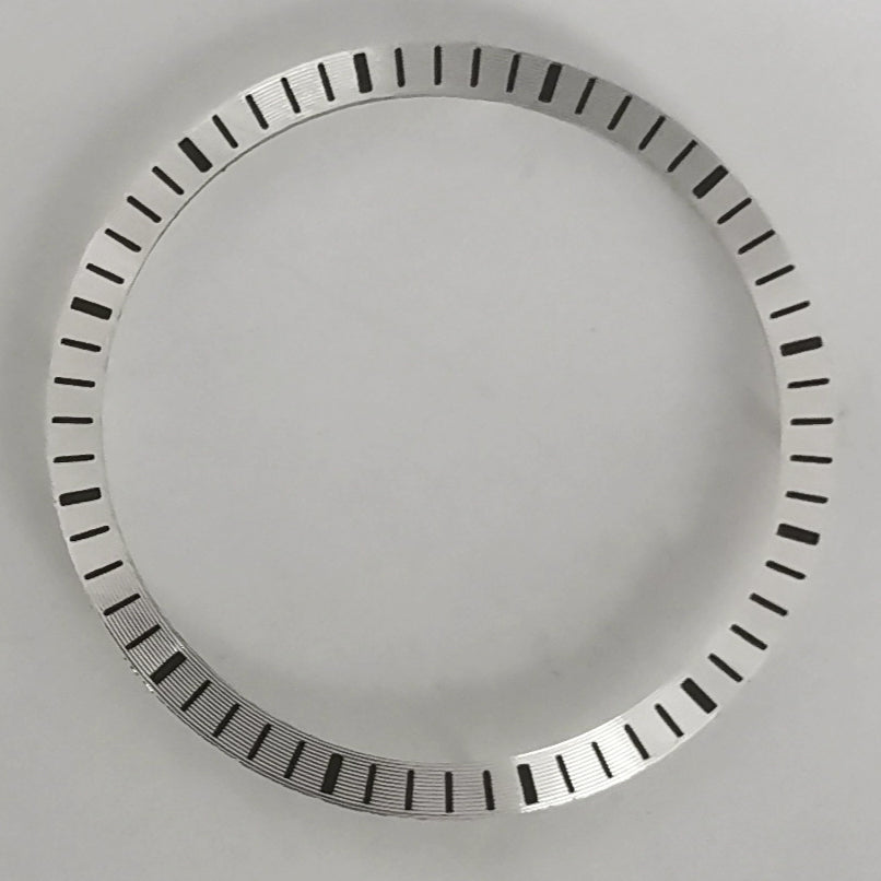 Silver watch chapter ring, 28.5x24.5mm, compatible with NH70 movement, enhancing dial detail.
