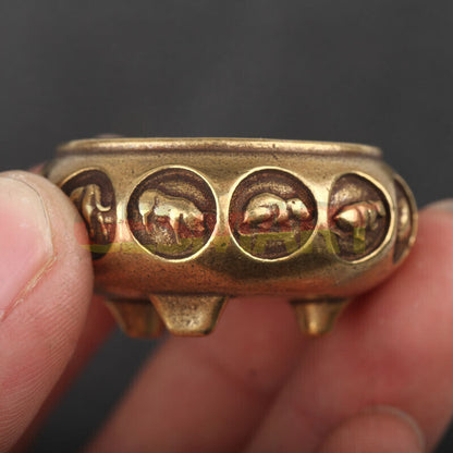 Hand-carved solid copper Zodiac incense burner featuring 12 Chinese animal figurines for home d�cor.