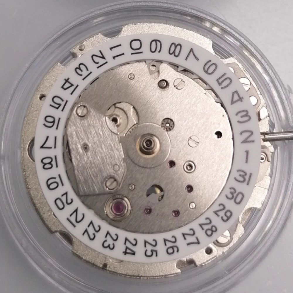 White dial watch accessory featuring Japan-made Miyota 8217 automatic mechanical movement for precise timekeeping.