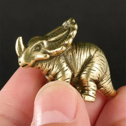 Vintage solid copper horned dinosaur figurine, hand-carved bronze model for Jurassic decor.